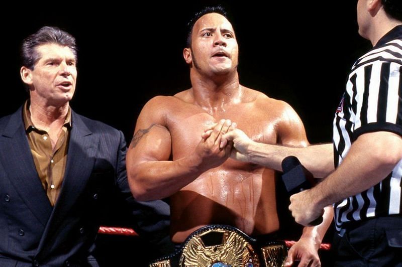 A seminal moment: Rock turns heel and becomes the Corporate Champion. We're betting Rocky wants to forget that terrible 90's hairdo, though.